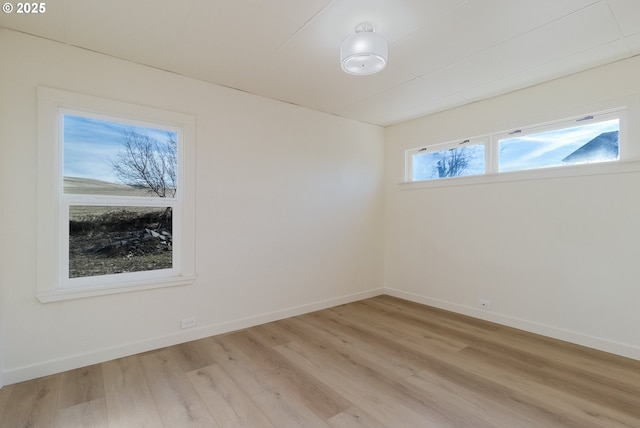 spare room featuring light hardwood / wood-style floors