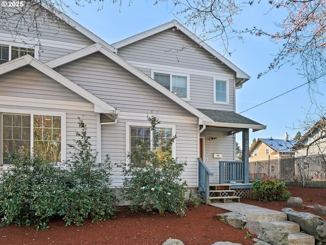 view of front of home with fence