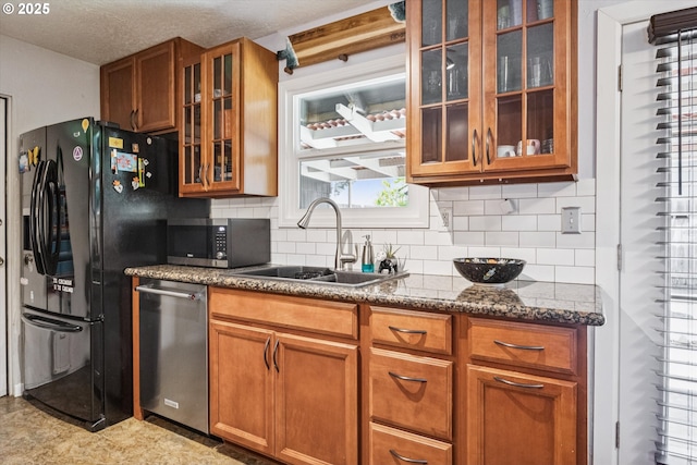 1903 SE 158th Ave, Portland, OR 97233 - kitchen featuring appliances with stainless steel finishes, glass insert cabinets, brown cabinets, tasteful backsplash, and dark stone counters