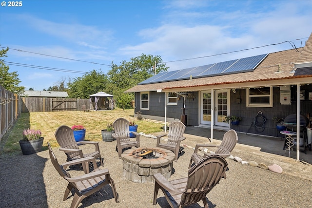 1903 SE 158th Ave, Portland, OR 97233 - fenced backyard with a fire pit, french doors, and a patio
