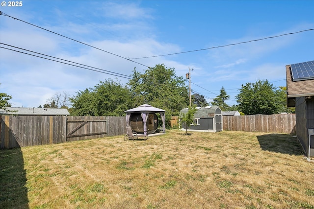 1903 SE 158th Ave, Portland, OR 97233 - fenced backyard featuring a gazebo and a storage shed