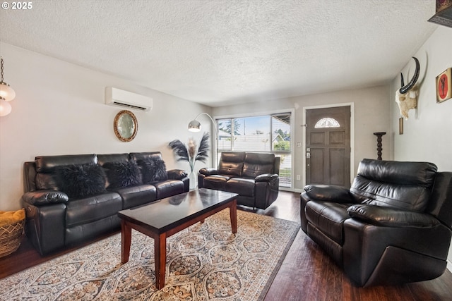 1903 SE 158th Ave, Portland, OR 97233 - living area featuring an AC wall unit, a textured ceiling, and wood finished floors
