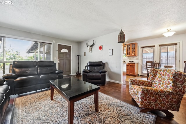 1903 SE 158th Ave, Portland, OR 97233 - living room with a textured ceiling, wood finished floors, and healthy amount of natural light