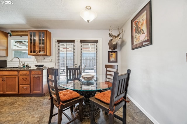 1903 SE 158th Ave, Portland, OR 97233 - dining room featuring a textured ceiling and french doors