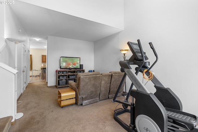 workout area with light colored carpet and baseboards