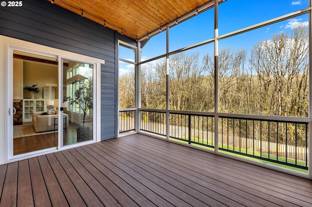 unfurnished sunroom featuring wood ceiling