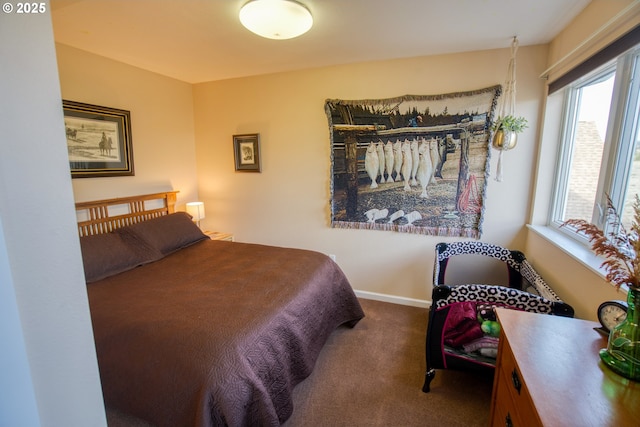 bedroom with carpet floors and baseboards