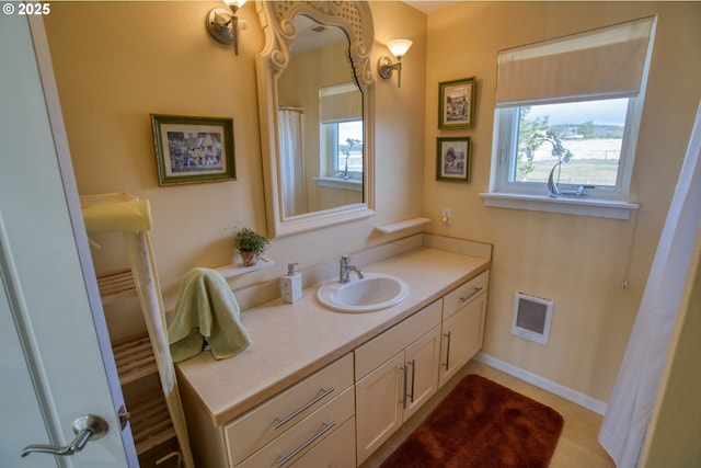 full bathroom with visible vents, baseboards, and vanity