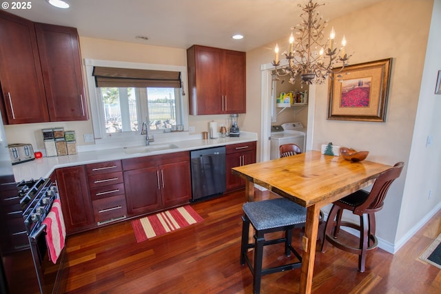 kitchen featuring a sink, gas stove, separate washer and dryer, dark wood-type flooring, and dishwashing machine