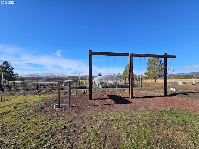 communal playground featuring fence