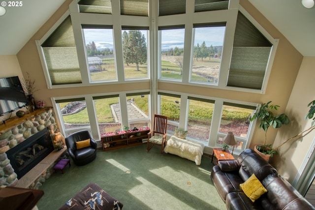interior space with a towering ceiling and carpet floors