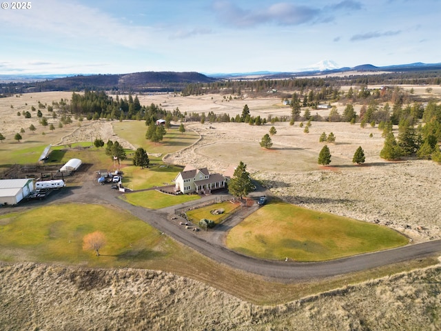 drone / aerial view featuring a rural view and a mountain view