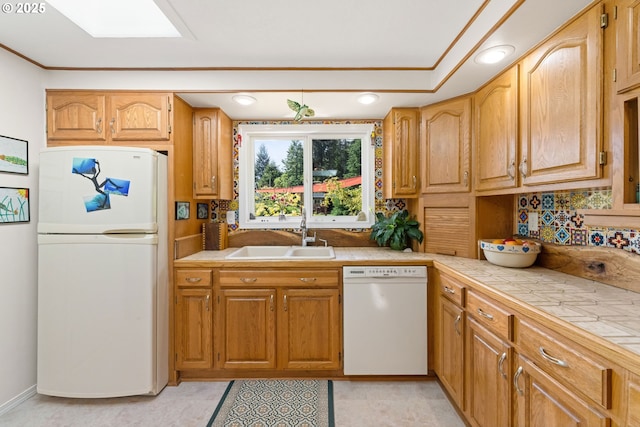 90726 Sanddollar Ln, Coos Bay, OR 97420 - kitchen with white appliances, a sink, tile countertops, tasteful backsplash, and crown molding