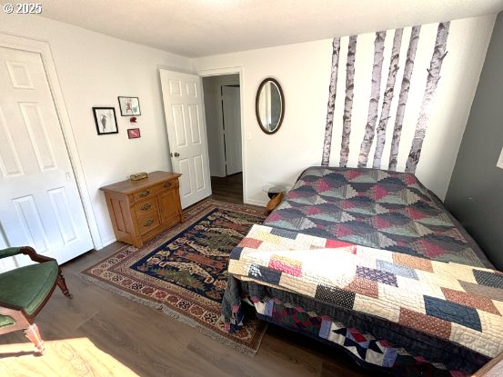 90726 Sanddollar Ln, Coos Bay, OR 97420 - bedroom with wood finished floors