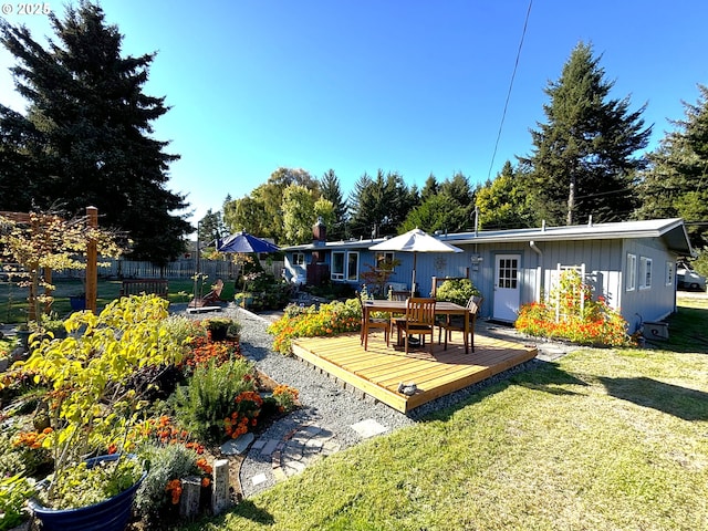 90726 Sanddollar Ln, Coos Bay, OR 97420 - rear view of property with board and batten siding, a wooden deck, and outdoor dining area