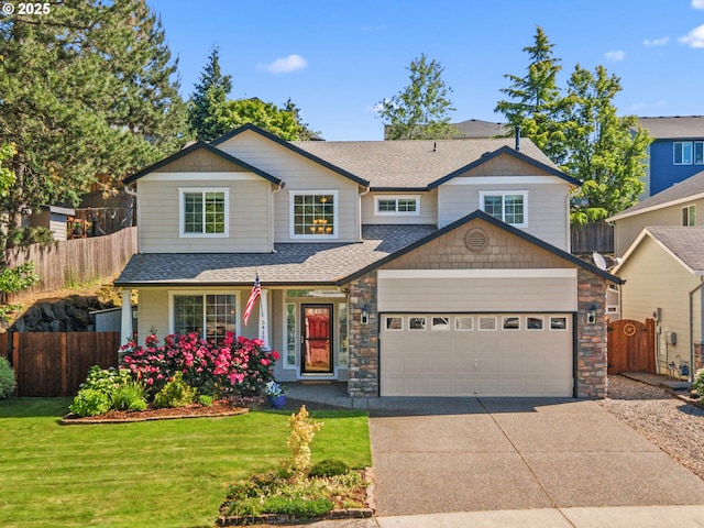 5417 N St, Washougal, WA 98671 - craftsman-style house featuring a garage, driveway, a shingled roof, and stone siding