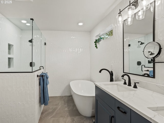 5417 N St, Washougal, WA 98671 - full bath featuring a shower stall, tile walls, double vanity, a freestanding bath, and recessed lighting
