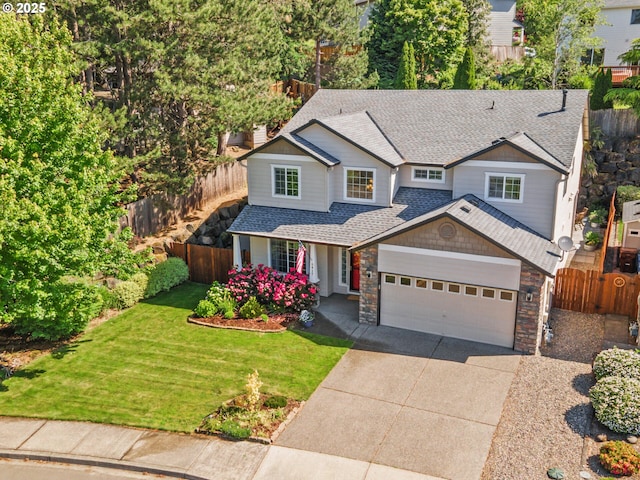 5417 N St, Washougal, WA 98671 - view of front of property featuring a shingled roof, driveway, a garage, and stone siding