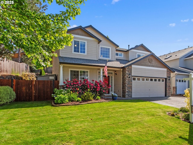 5417 N St, Washougal, WA 98671 - craftsman-style house with driveway, an attached garage, and stone siding