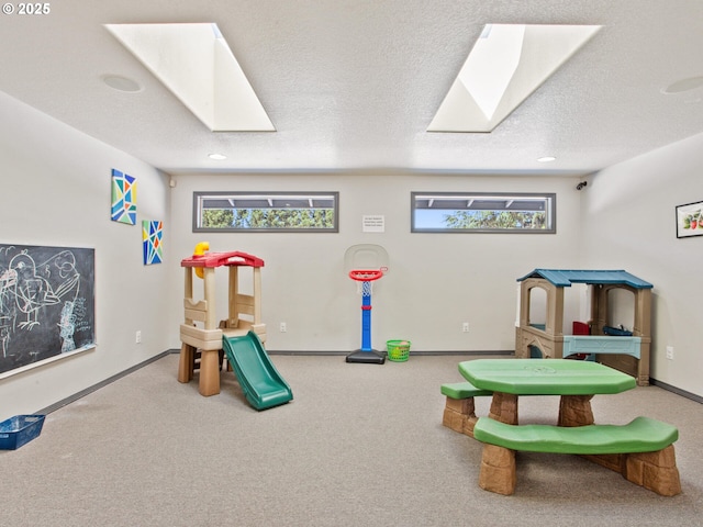 5417 N St, Washougal, WA 98671 - rec room with a skylight, carpet floors, baseboards, and recessed lighting