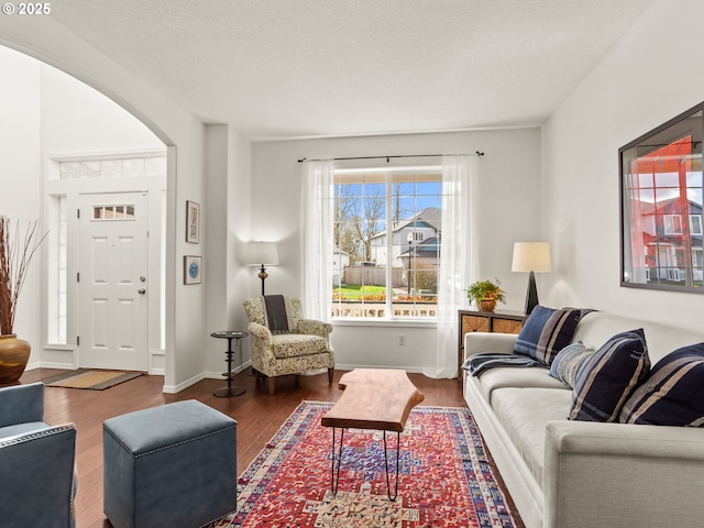 5417 N St, Washougal, WA 98671 - living area featuring wood finished floors, arched walkways, and baseboards