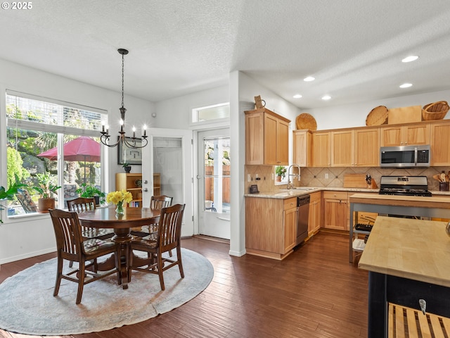 5417 N St, Washougal, WA 98671 - kitchen with appliances with stainless steel finishes, light countertops, a chandelier, a sink, and tasteful backsplash