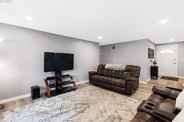 living room with recessed lighting, wood finished floors, and baseboards