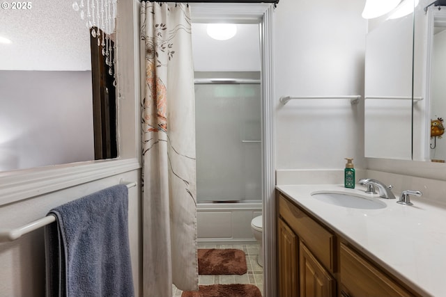 bathroom featuring tile patterned floors, toilet, vanity, enclosed tub / shower combo, and a textured ceiling