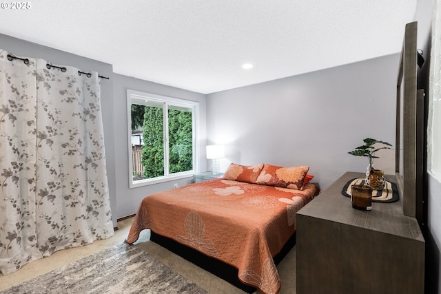 carpeted bedroom featuring recessed lighting