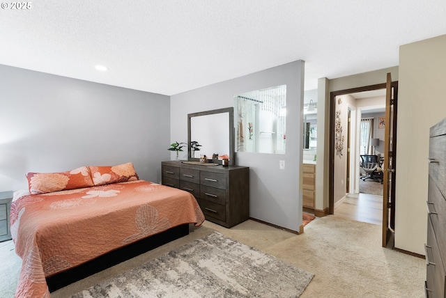 bedroom featuring baseboards and light carpet