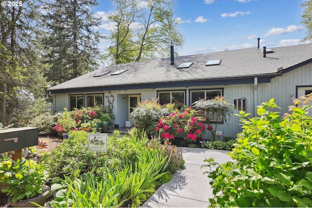view of front of house featuring roof with shingles