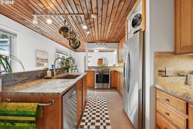 kitchen featuring a healthy amount of sunlight, light floors, wooden ceiling, a sink, and stainless steel appliances