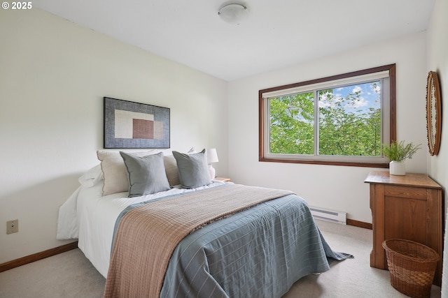 bedroom featuring carpet flooring, baseboards, and baseboard heating