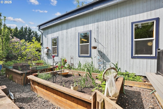 view of side of home with a vegetable garden
