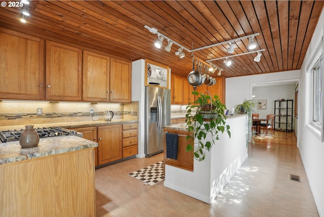 kitchen featuring wood ceiling, visible vents, appliances with stainless steel finishes, tasteful backsplash, and track lighting