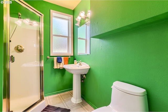 7680 SW 92nd Pl, Portland, OR 97223 - full bathroom featuring a shower stall, toilet, tile patterned floors, and a sink