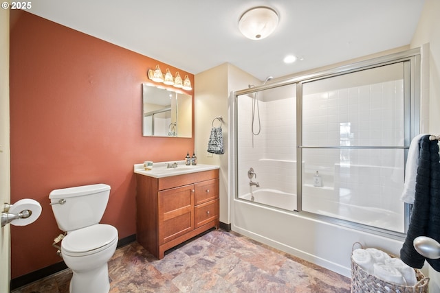 full bathroom with shower / bath combination with glass door, vanity, and toilet