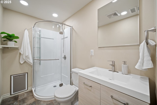 bathroom with vanity, toilet, and an enclosed shower