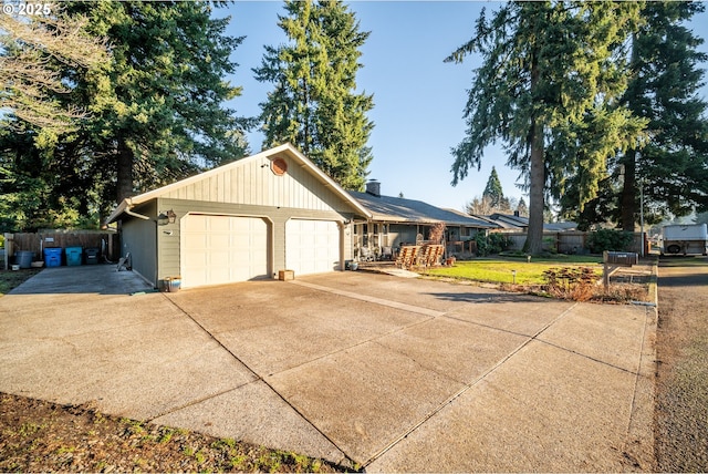 view of front of home featuring a front yard and a garage