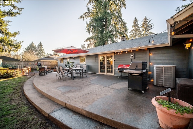 view of patio featuring central air condition unit and a grill