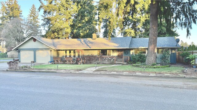 ranch-style home featuring a garage