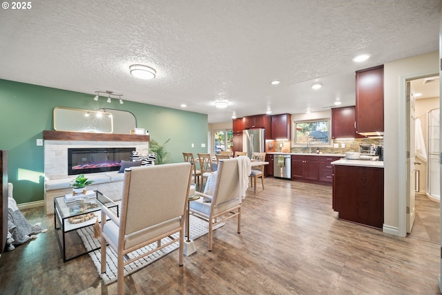 interior space with sink, hardwood / wood-style floors, and a textured ceiling