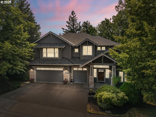 711 NW 94th Ter, Portland, OR 97229 - craftsman-style home with a garage, concrete driveway, stone siding, and a shingled roof
