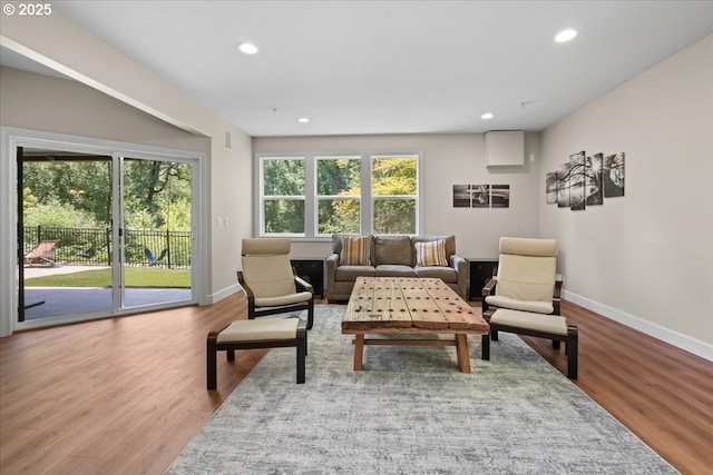 711 NW 94th Ter, Portland, OR 97229 - living area featuring wood finished floors and recessed lighting