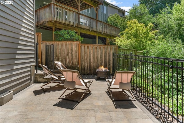 711 NW 94th Ter, Portland, OR 97229 - view of patio with a fire pit and a wooden deck