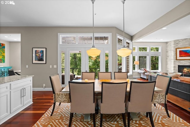 711 NW 94th Ter, Portland, OR 97229 - dining area featuring dark wood-style floors, a fireplace, and recessed lighting