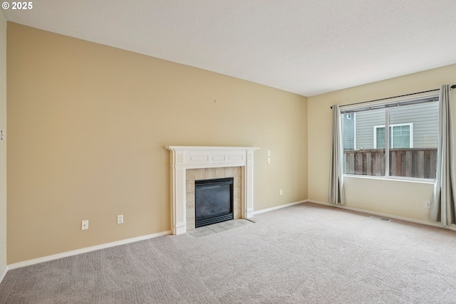 6538 NE Forest Ln, Hillsboro, OR 97124 - unfurnished living room with carpet flooring and a tile fireplace