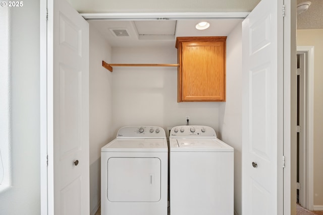 6538 NE Forest Ln, Hillsboro, OR 97124 - laundry room featuring cabinet space and washing machine and dryer