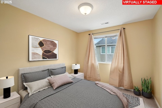 6538 NE Forest Ln, Hillsboro, OR 97124 - carpeted bedroom featuring a textured ceiling