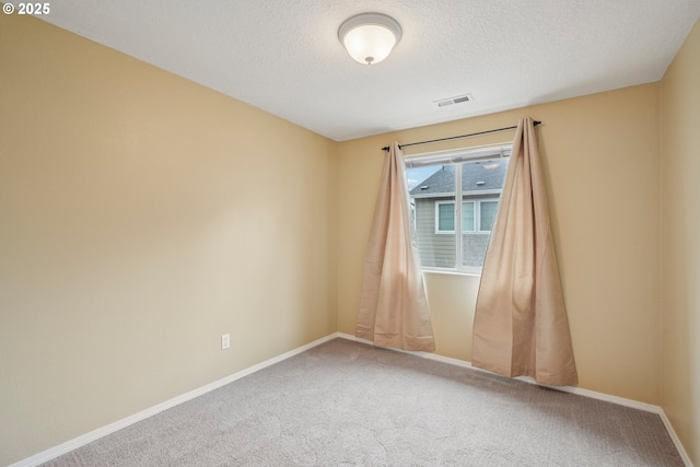 6538 NE Forest Ln, Hillsboro, OR 97124 - carpeted spare room featuring baseboards and a textured ceiling